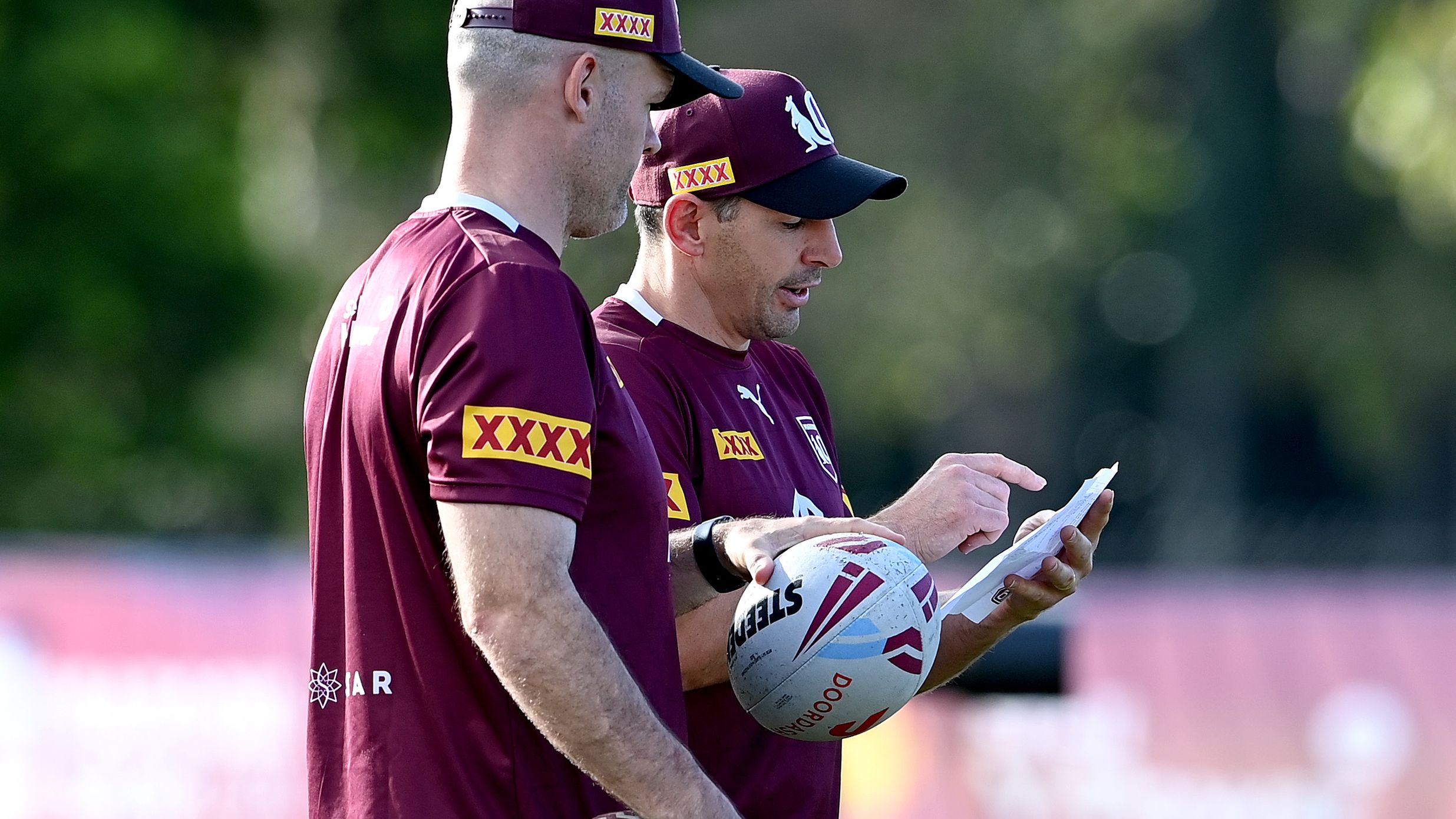 Coach Billy Slater and his assistant Nate Myles are seen talking tactics during a Queensland Maroons training session at Sanctuary Cove.