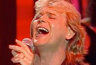 What is the first line of John Farnham's 'You're the Voice'?