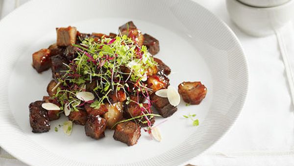 Crisp pork hock with roasted almond and chilli salad