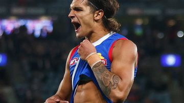 Jamarra Ugle-Hagan of the Bulldogs points to his skin as he celebrates kicking a goal during the round three AFL match between Western Bulldogs and Brisbane Lions at Marvel Stadium, on March 30, 2023, in Melbourne, Australia. (Photo by Daniel Pockett/Getty Images)