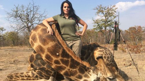 Hunter causes outrage with photos posed next to dead giraffe