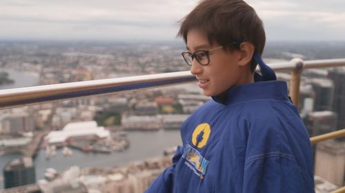 Sydney schoolboy who lost sight given VIP tour of Sydney Tower Eye for Jeans for Genes Day.