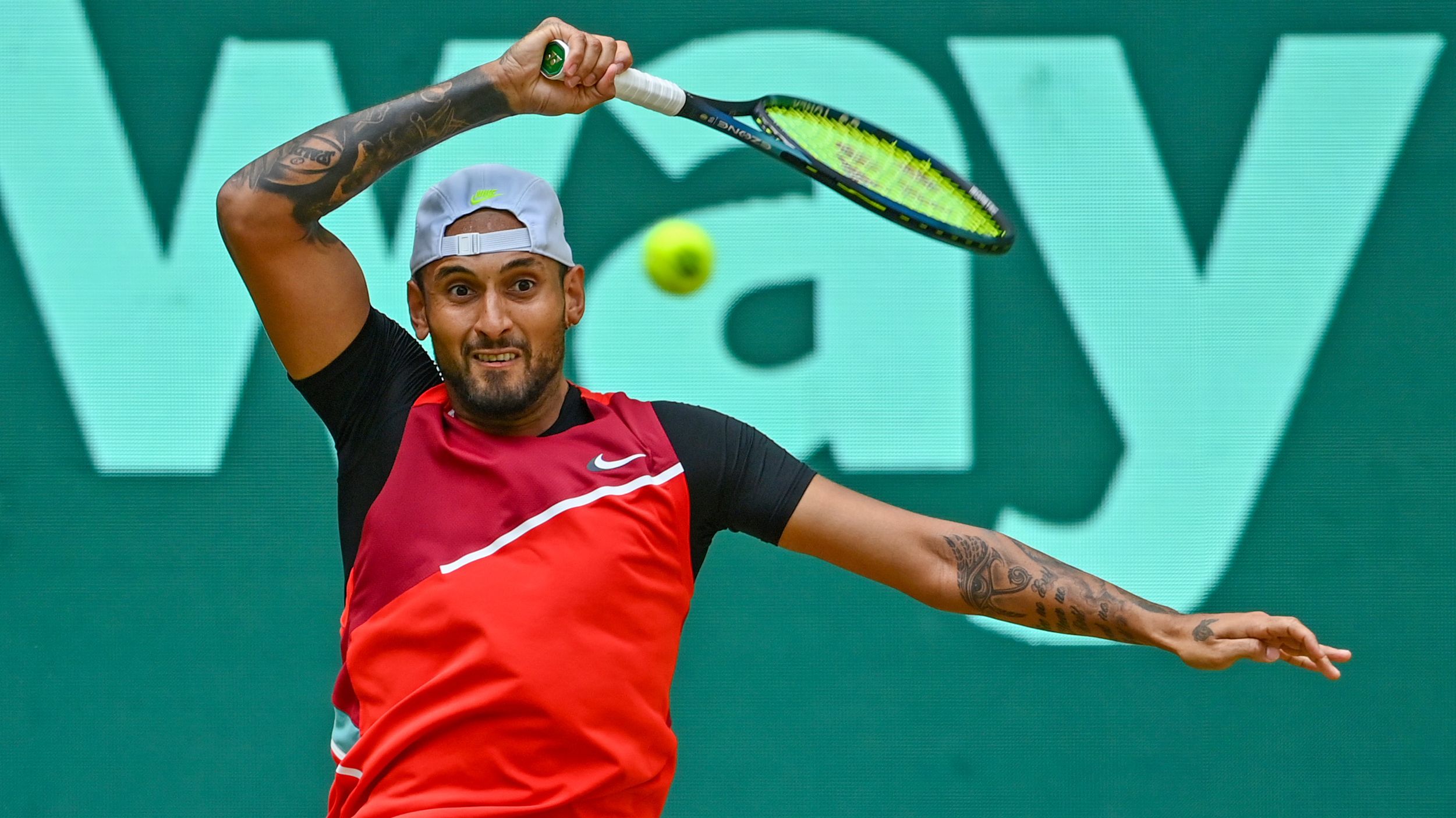 Nick Kyrgios plays a forehand in his match against Pablo Carreno Busta.