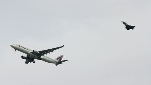An RAF jet escorts the Qatar Airways flight. (AAP)
