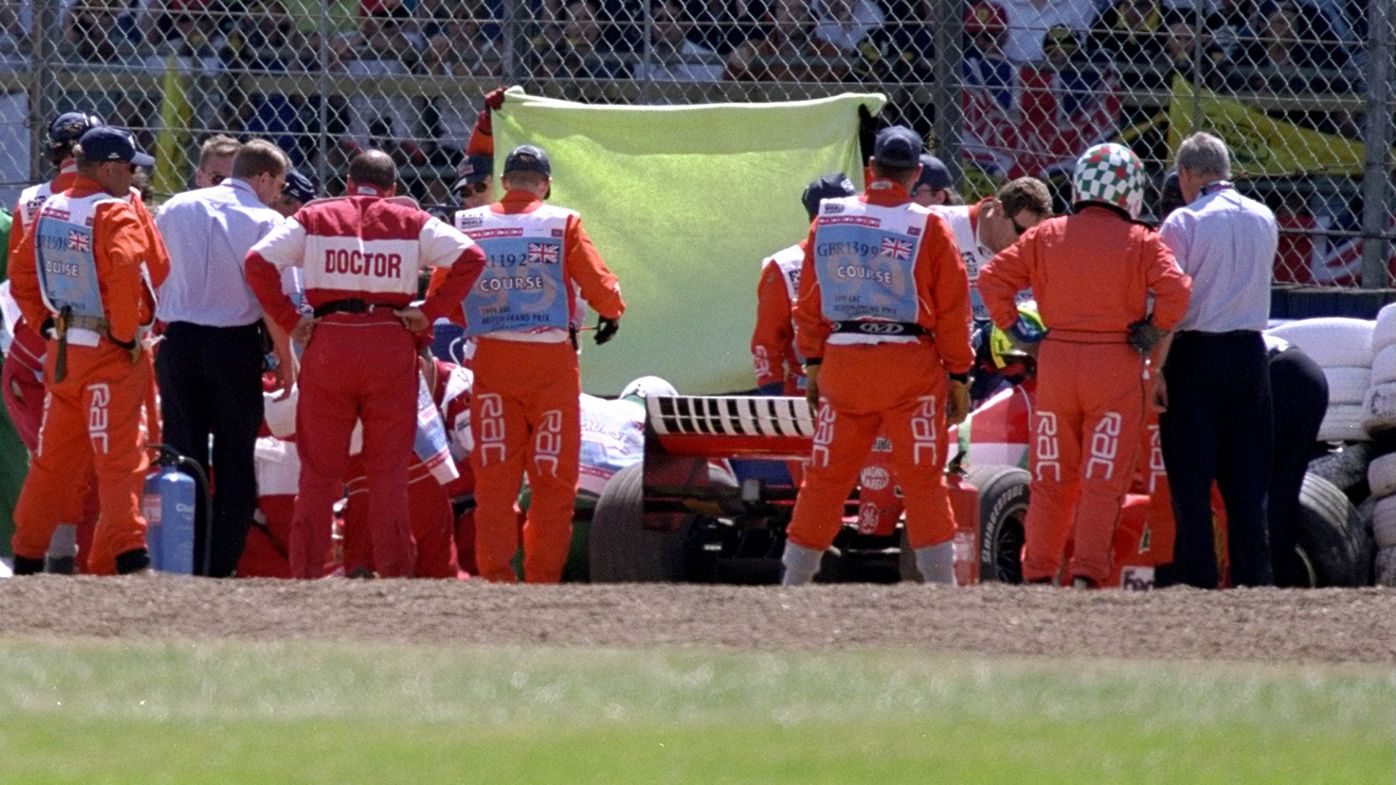 Michael Schumacher is removed from his Ferrari after a huge crash at the 1999 British Grand Prix.