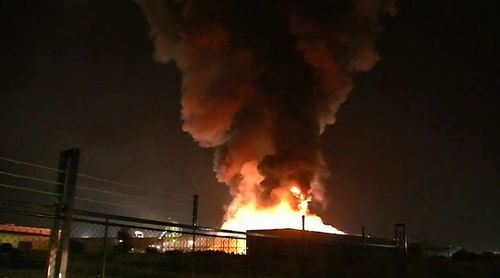 A metal recycling plant in Brisbane's east was turned into a flaming inferno due to a spark from a working machine. Picture: 9NEWS.