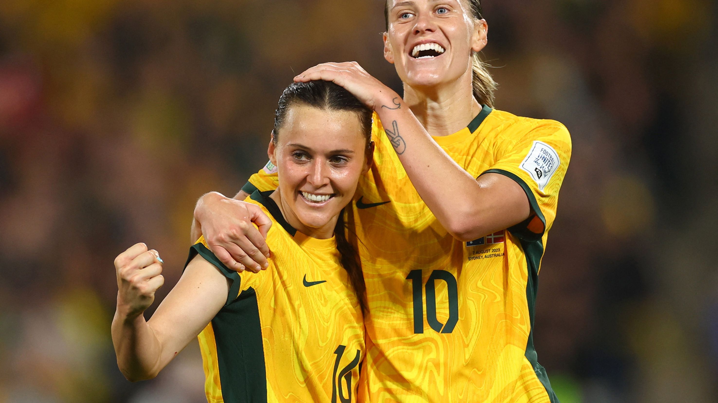 Australia&#x27;s Hayley Raso celebrates scoring her first goal of the match with teammate Emily van Egmond.