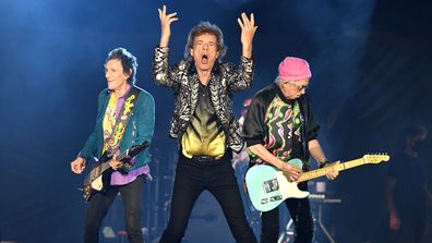  Ronnie Wood, Mick Jagger and Keith Richards of The Rolling Stones perform onstage at Nissan Stadium on October 09, 2021 in Nashville, Tennessee.