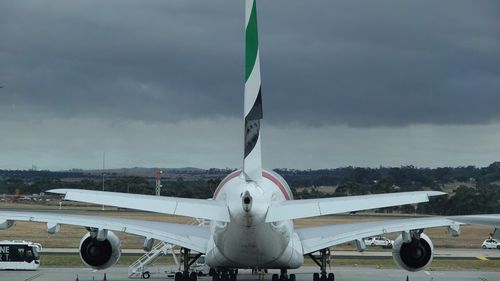 An Emirates airlines jet waits on the tarmac at Melbourne Airport last December.