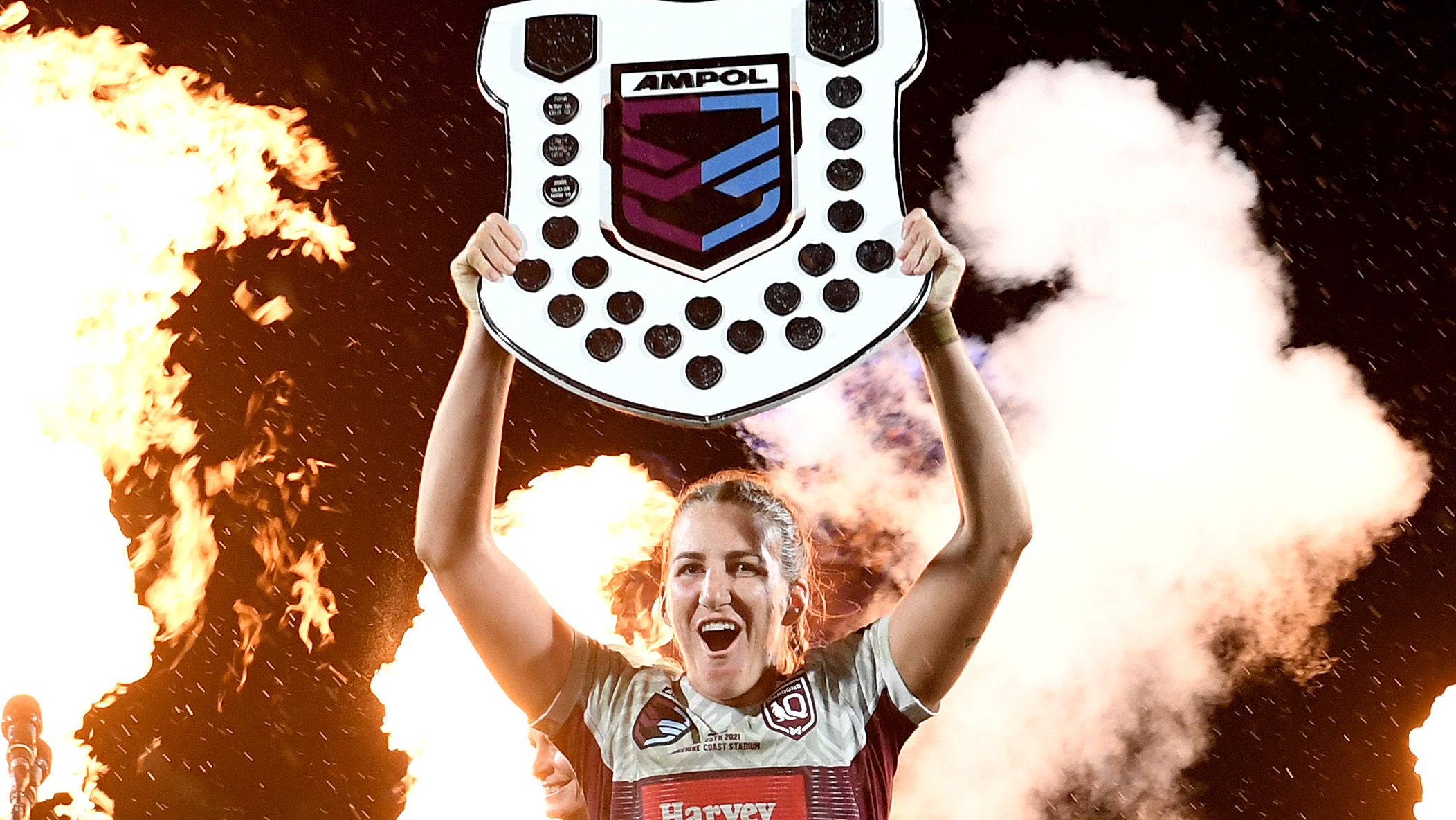 Queensland Maroon&#x27;s captain Ali Brigginshaw holds up the shield as she celebrates victory after the Women&#x27;s State of Origin match.