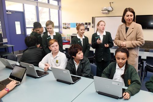 NSW Premier Gladys Berejiklian (right) talks to students during a visit to Kent Road Public School in Marsfield, Sydney. (AAP)