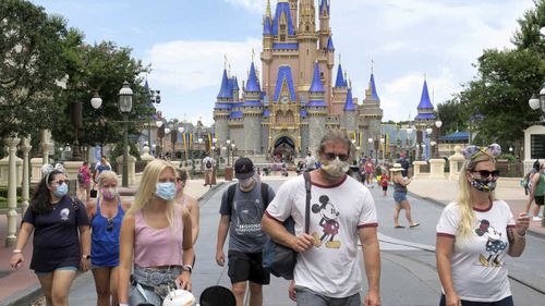 Disney World has reopened, but the proper wearing of masks is mandatory.