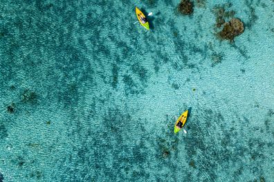Canoe and kayaks in Polynesia Cook Islands tropical paradise Aitutaki panorama landscape