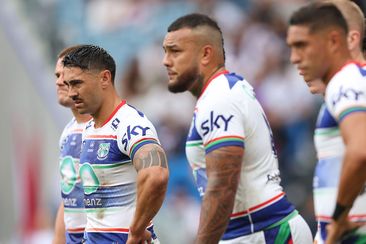 Shaun Johnson and his Warriors teammates look on after conceding a try against the Roosters.