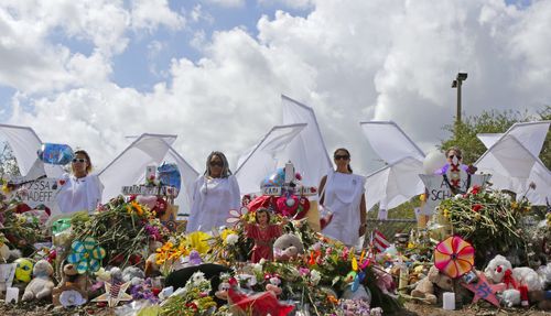 Flowers at a memorial for the slain Florida shooting victims.