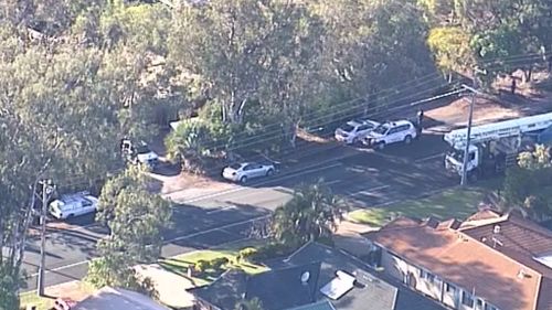 Nearby streets have been locked down while police search for the offender. (9NEWS)