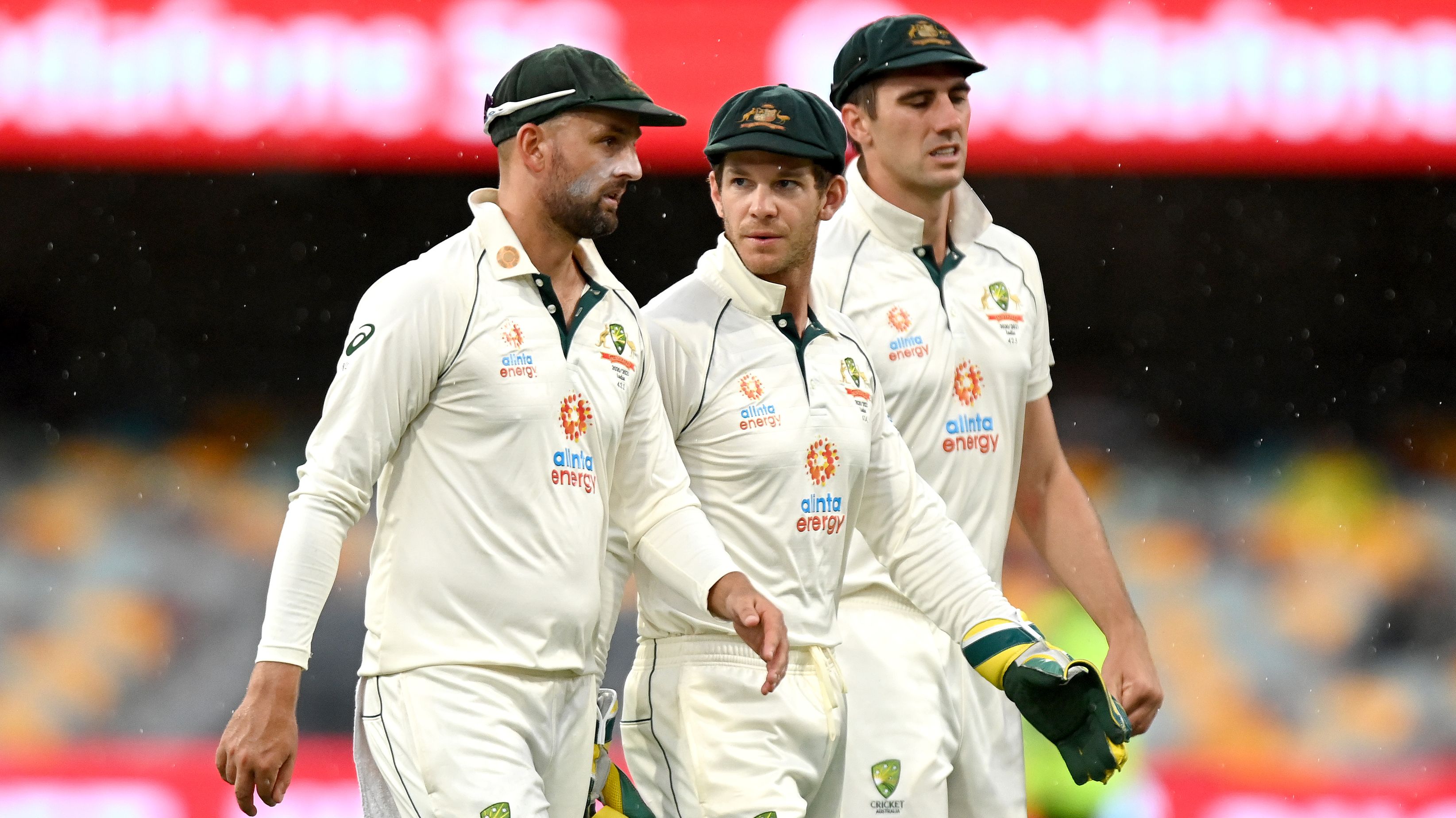 Tim Paine (centre) with Nathan Lyon and Pat Cummins of Australia.