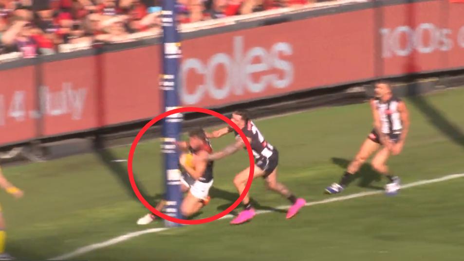 Essendon player Jye Menzie collided with the goalpost.