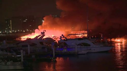 Fire fighters were able to save more then 200 boats moored at the marina. (Supplied/ AP)