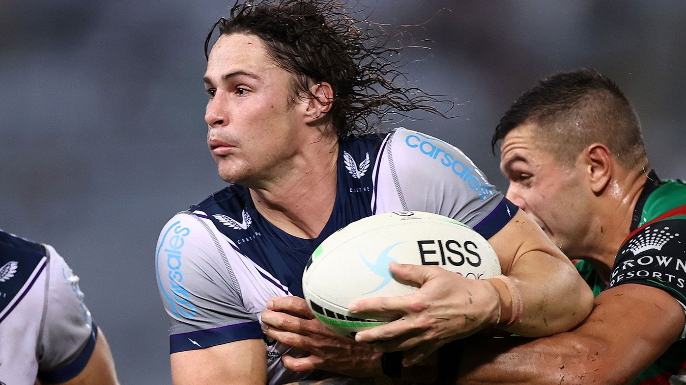 Nicho Hynes of the Storm is tackled during the round nine NRL match between the South Sydney Rabbitohs and the Melbourne Storm at Stadium Australia on May 06, 2021, in Sydney, Australia. (Photo by Cameron Spencer/Getty Images)