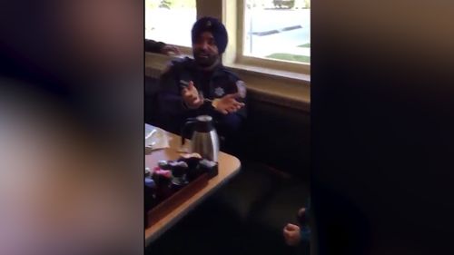 In a touching video Deputy Dhaliwal can be seen playing with a young boy who is deaf. 