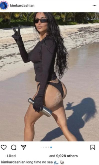 Kim Kardashian deletes bikini photo after fans accuse her of Photoshopping image.