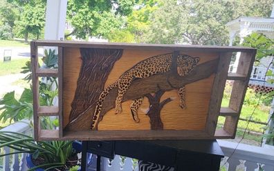 Chuck Perkins's 1980 carving of a cheetah went on a long journey to find its way home. CNN