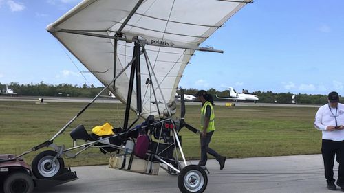 Personnel examine an ultralight aircraft that landed illegally at the airport carrying two Cuban men Saturday, March 25, 2023, in Key West, Florida.