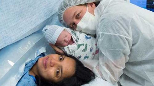 US couple charged $51 to hold their newborn son