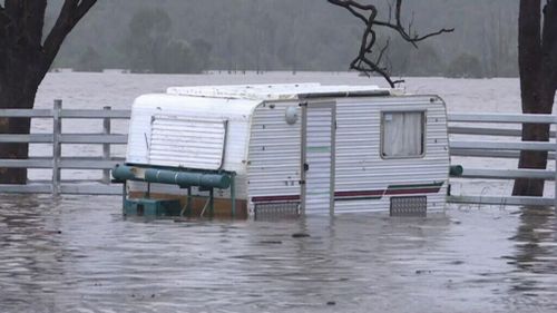 The weather system will bring more rain to flooded parts of Queensland. 