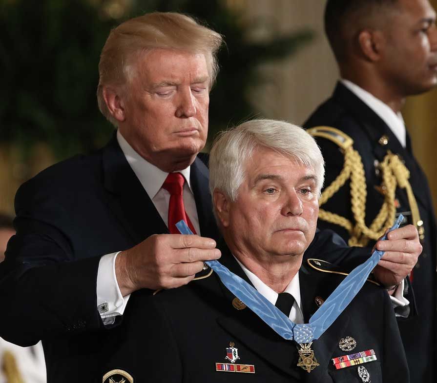 Donald Trump gives the Medal of Honor to James McCloughan.