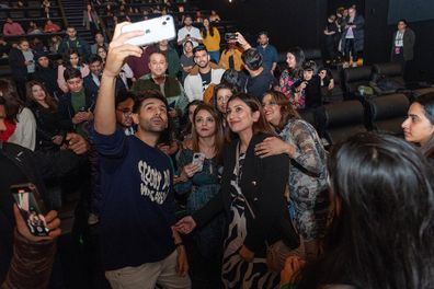 Kartik Aaryan taking pictures with his fans at the screening of Satyaprem Ki Katha for the Indian Film Festival of Melbourne, 2023.