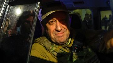 Yevgeny Prigozhin looks out from a military vehicle on a street in Rostov-on-Don, Russia