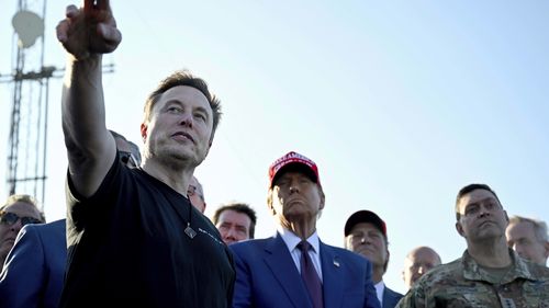 President-elect Donald Trump listens to Elon Musk at the launch of the sixth test flight of the SpaceX Starship rocket Tuesday, Nov. 19, 2024 in Boca Chica, Texas. (Brandon Bell/Pool via AP)