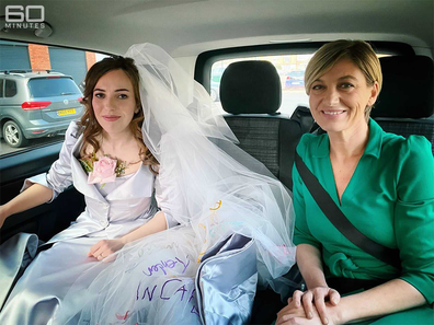Reporter Tara Brown with Stella Moris on the way to her wedding.