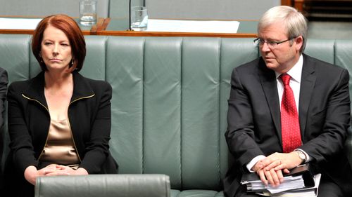 A 2010 file photo of then Prime Minister Julia Gillard and foreign minister Kevin Rudd during a House of Representatives division in Canberra.