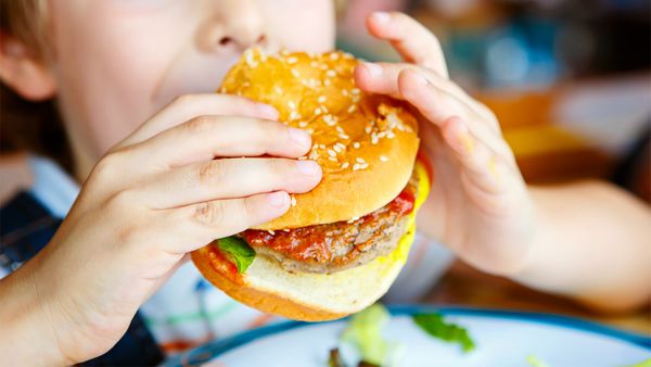 Boy eats burger