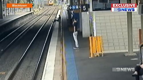 In Blacktown, it was a deliberate game of chicken as a person seen on CCTV footage sees a train coming but sits down anyway. Picture: Supplied