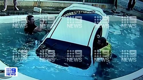 CCTV has captured the moment a young woman ploughed her car through the fence of a Perth home and landed in the swimming pool. 