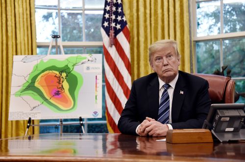 US President Donald Trump speaks during a briefing on the looming threat of Hurricane Florence with the Secretary of the Department of Homeland Security and the Administrator of the Federal Emergency Management Agency in the Oval Office.