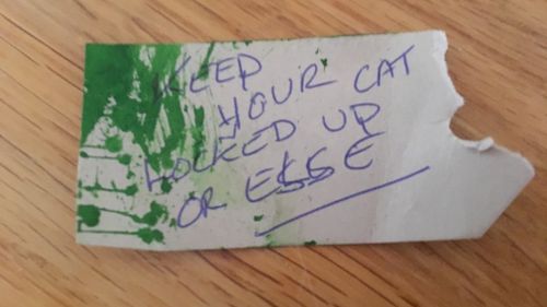 This threatening note was found attached to the cat's neck.