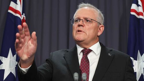 Scott Morrison challenges a reporter at a press conference.