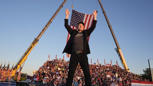 FILE - Tesla and SpaceX CEO Elon Musk walks to the stage to speak at the Butler Farm Show, Oct. 5, 2024, in Butler, Pa. (AP Photo/Alex Brandon, file)