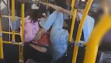 CCTV has shown passengers throwing punches inside a Brisbane City Council bus.