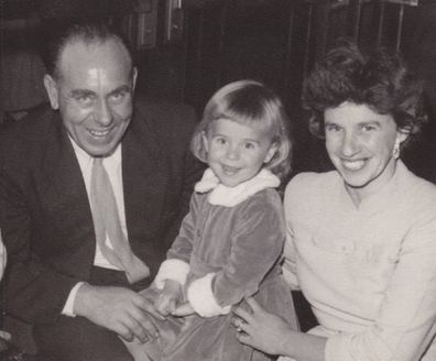 Michelle as a toddler with her father George and her mother Erica.