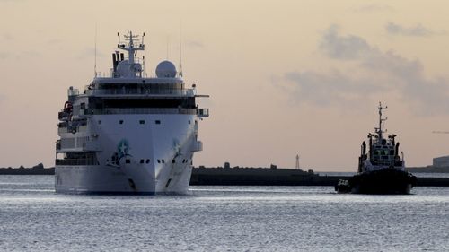 The Australian cruise ship Greg Mortimer, carrying some passengers infected with the new coronavirus, arrives to the port in Montevideo, Uruguay.