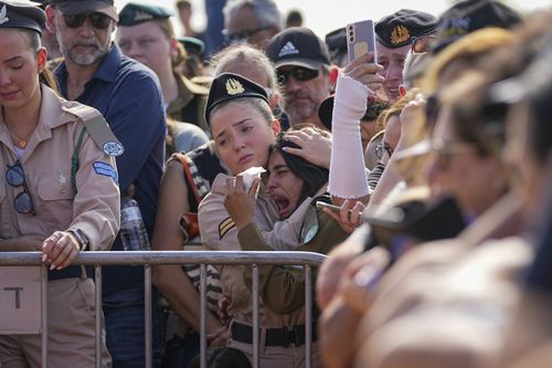 Mourners attend the funeral of the Kotz family in Gan Yavne, Israel, Tuesday, Oct. 17, 2023. 