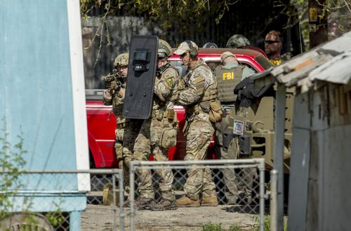 Heavily armed tactical police officers have swooped on Mark Anthony Conditt's home in Pflugerville, Texas. (AAP)