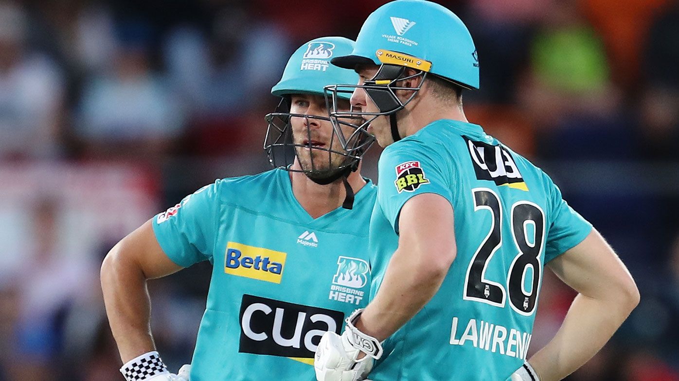 Chris Lynn and Dan Lawrence of the Heat chat during the Big Bash League match between the Sydney Thunder and the Brisbane Heat at Manuka Oval, on December 14, 2020, in Canberra, Australia.