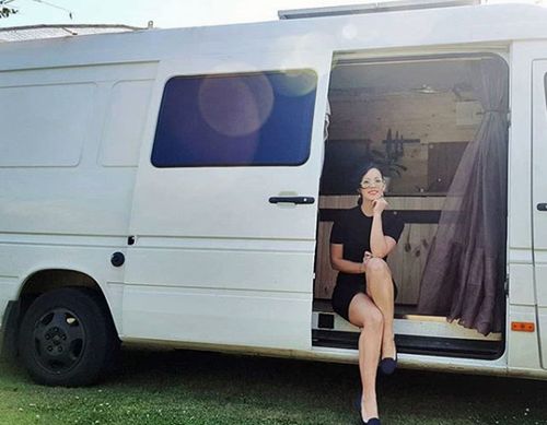 Charlie Charters with her Mercedes Sprinter van.